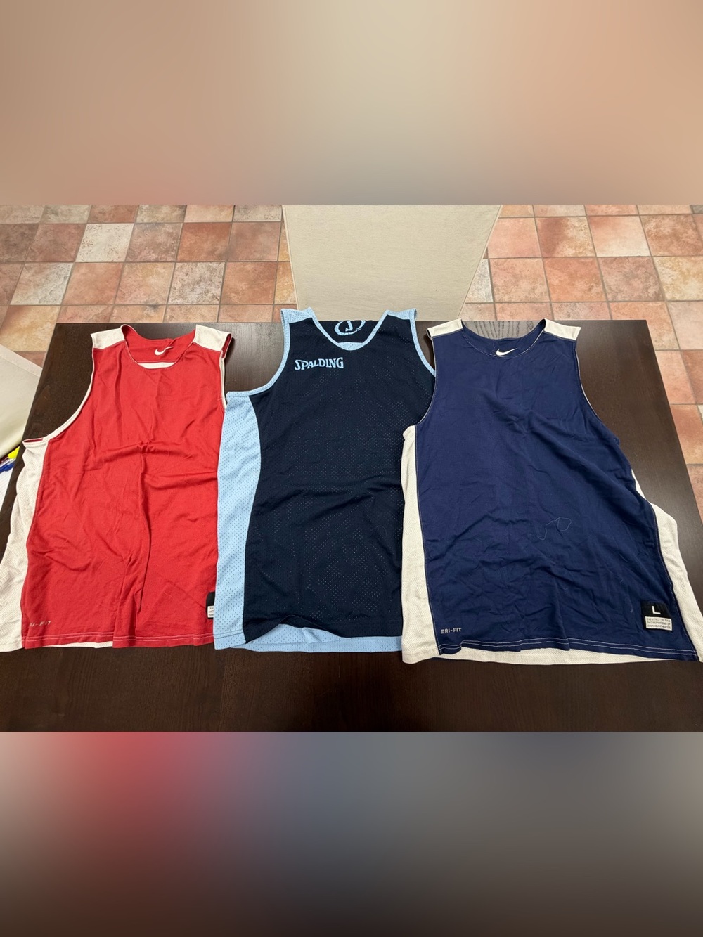 Three size large reversible basketball jerseys